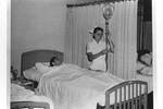 Nurse and patient, Jefferson Medical College Hospital (Main Building), [1940s or 50s]